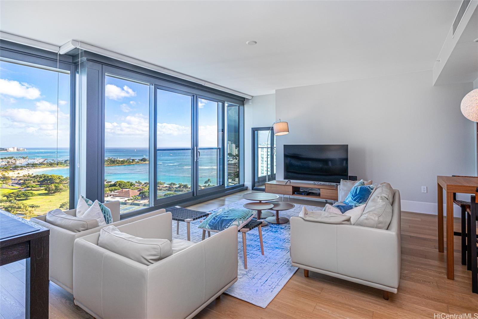 a living room with furniture and a flat screen tv