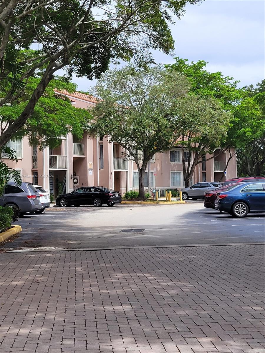 a view of street with parked cars