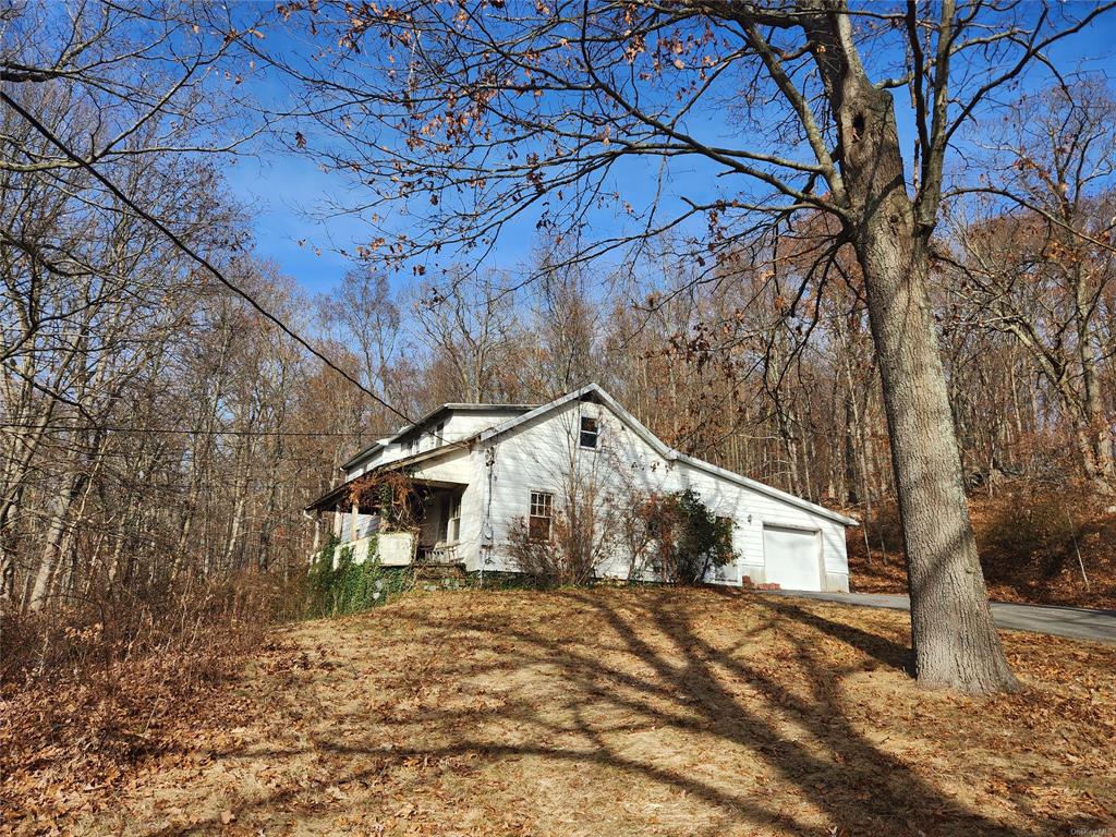 View of homes exterior with a garage