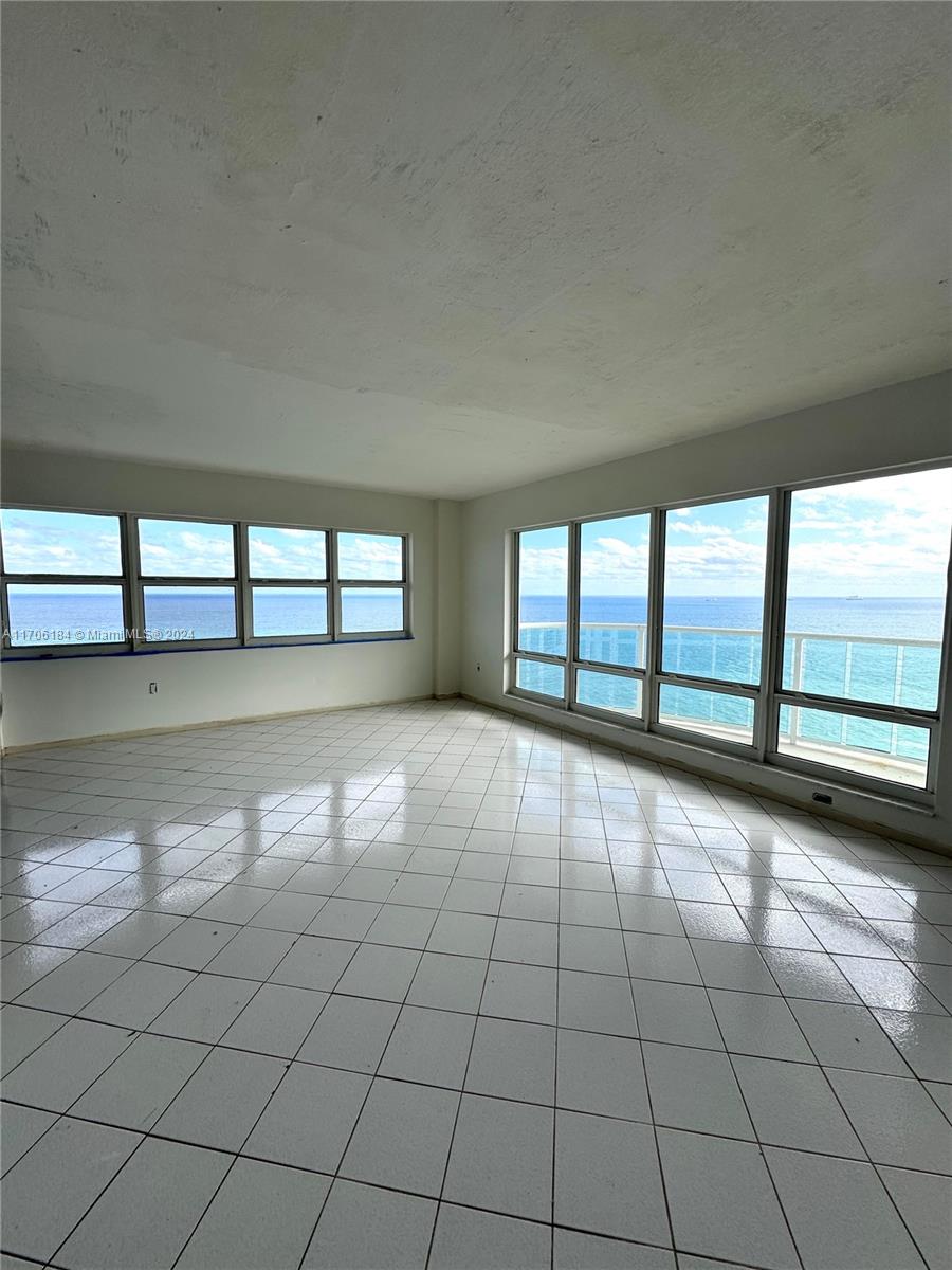 a view of an empty room and window