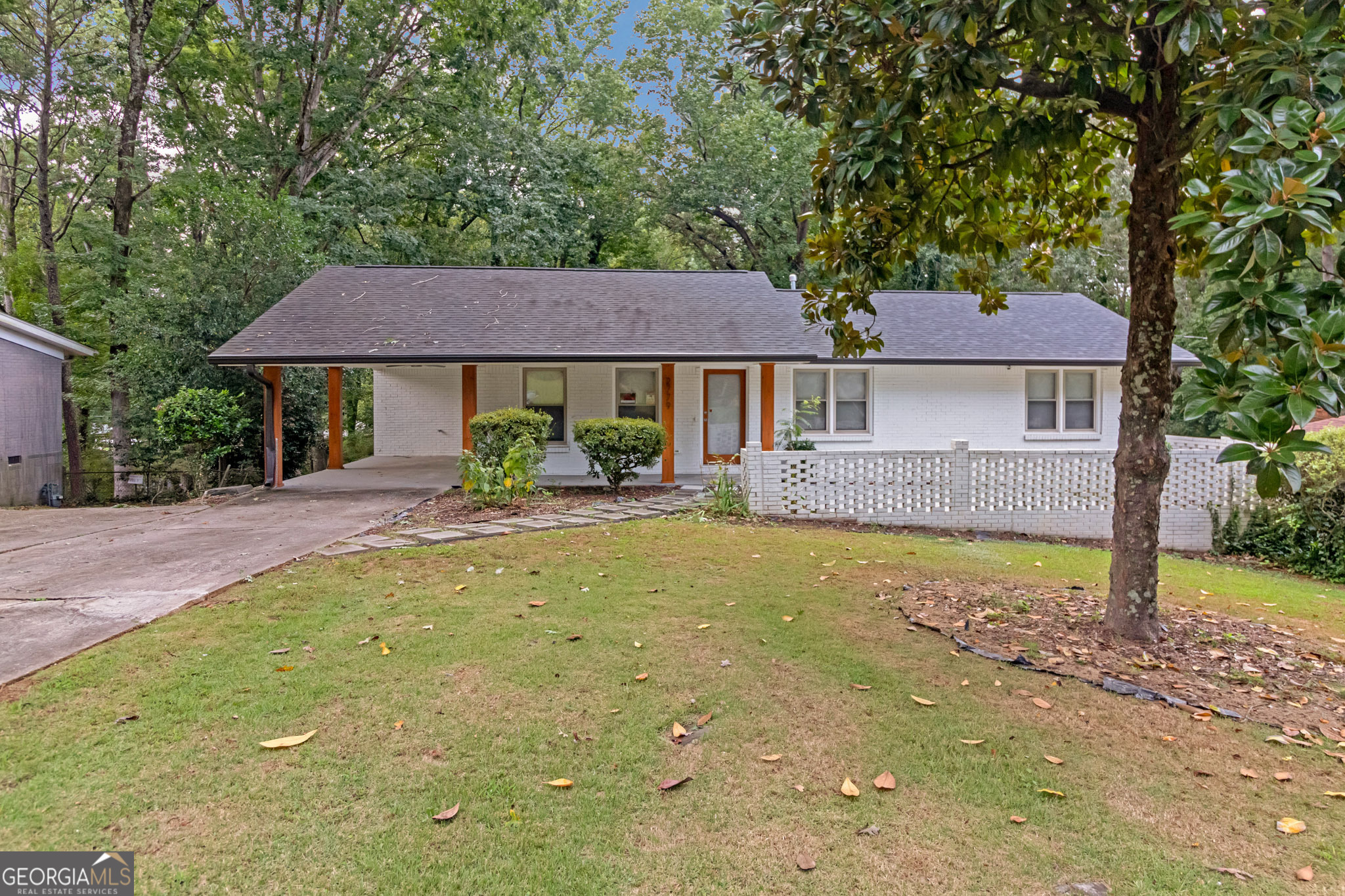 a house view with a garden space