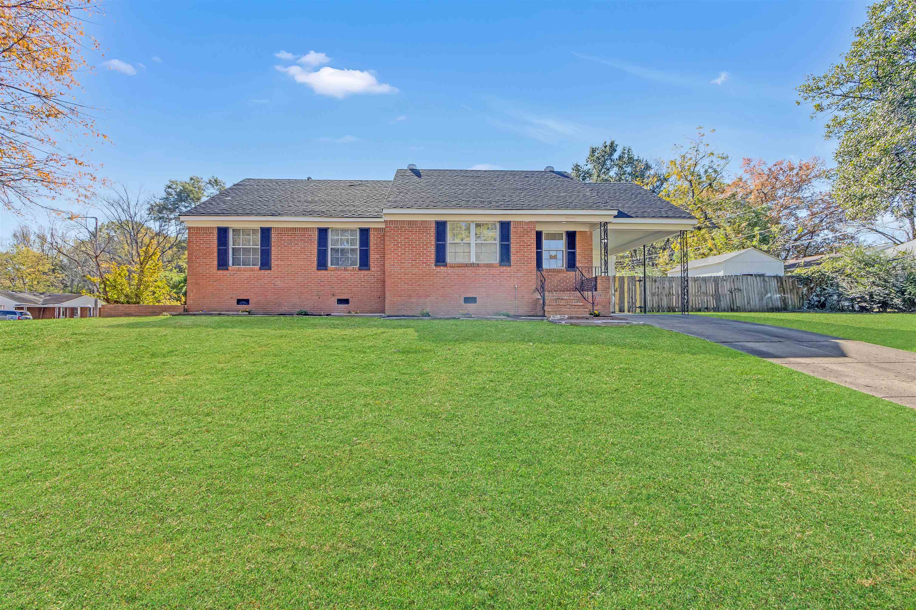 View of front of property with a front yard