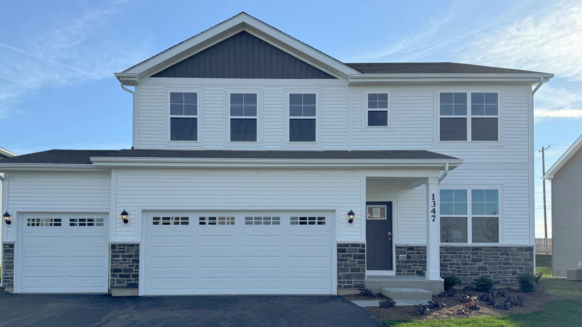 a view of a house with a garage