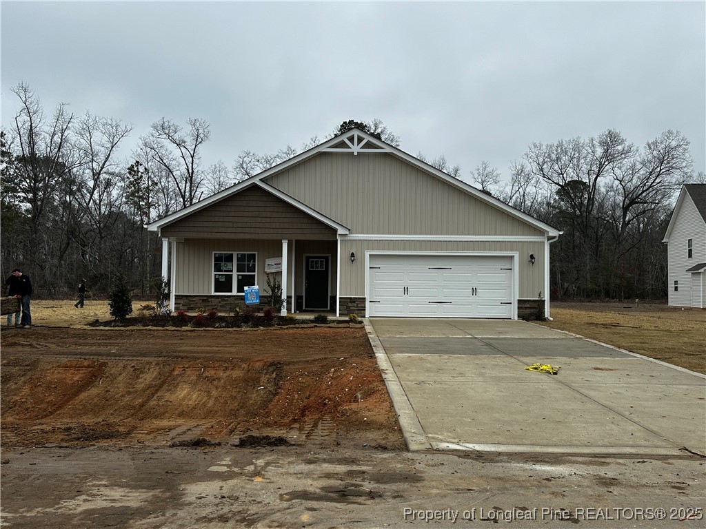 a front view of a house with garage