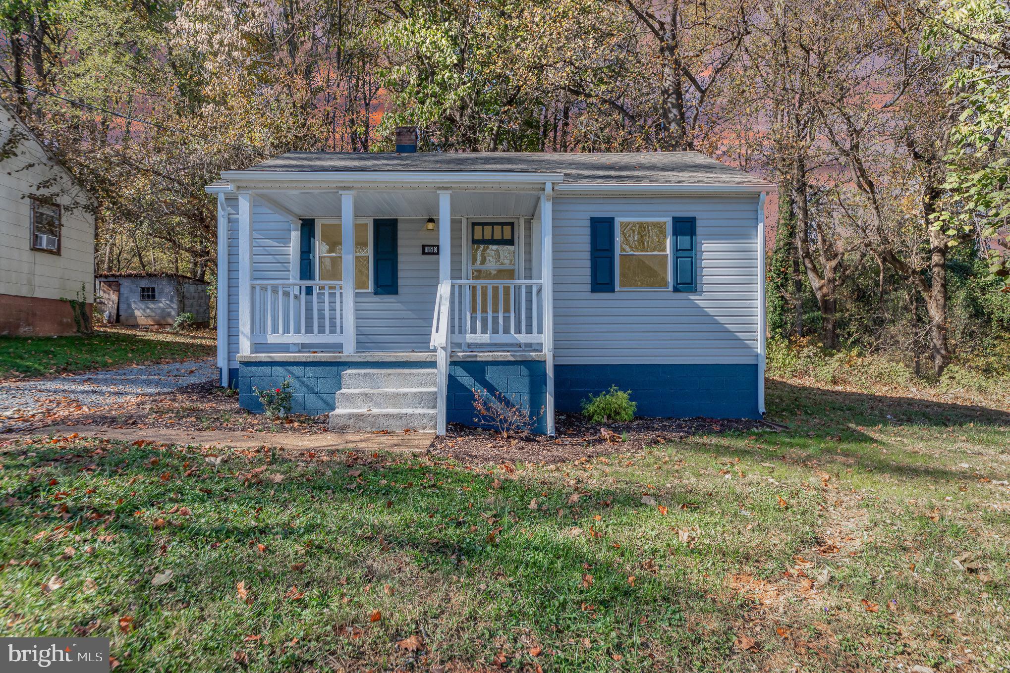 front view of a house with a yard