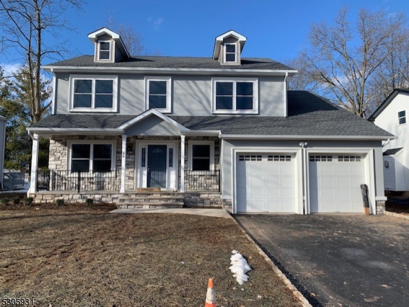 a front view of a house with yard