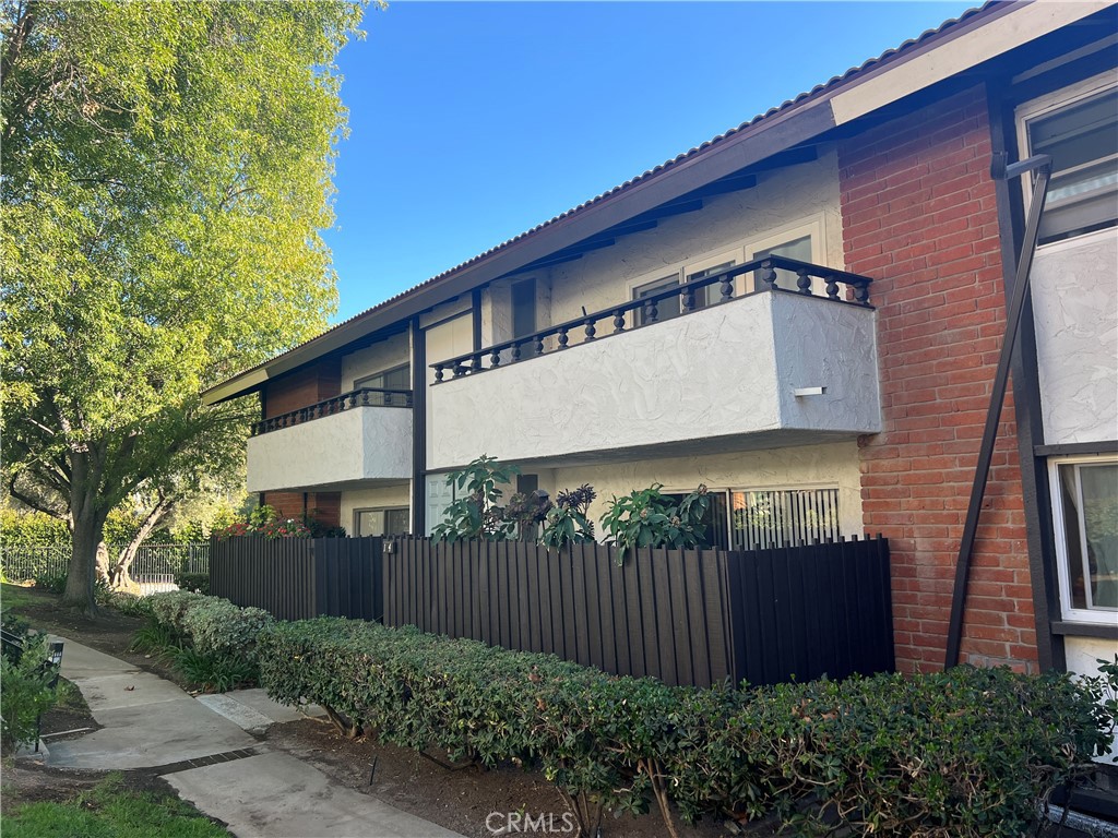 front view of a house with a garden