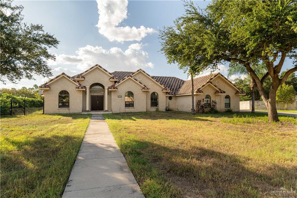 Mediterranean / spanish-style home featuring a front lawn