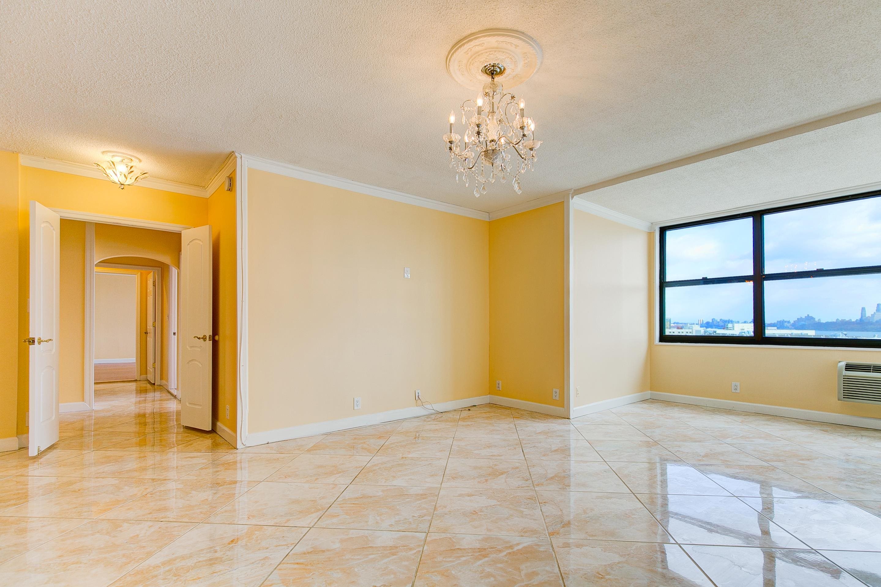 a view of an empty room with a window