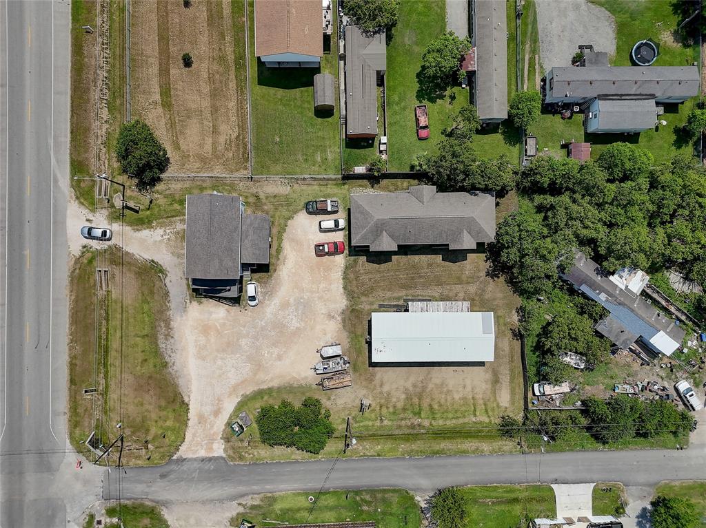 an aerial view of a house with outdoor space