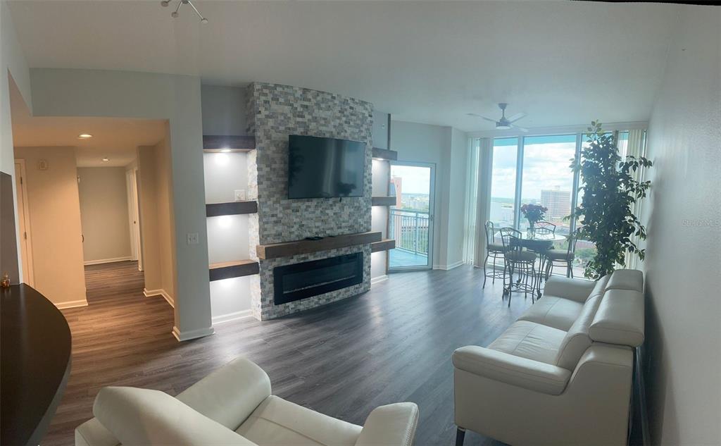 a living room with furniture and a fireplace