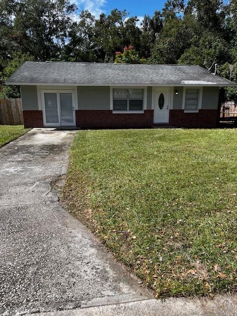 front view of a house with a yard