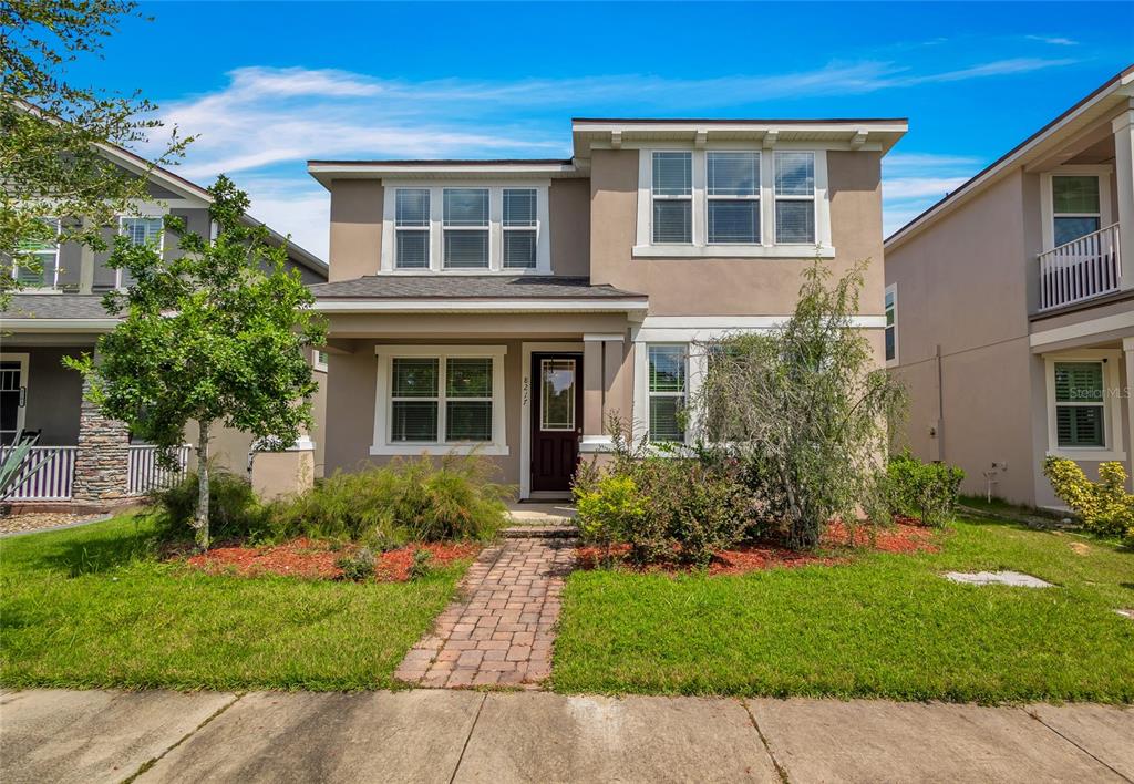 front view of a house with a yard