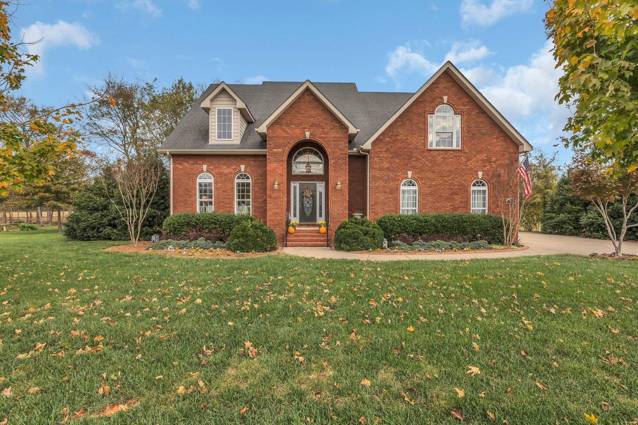 a front view of a house with garden