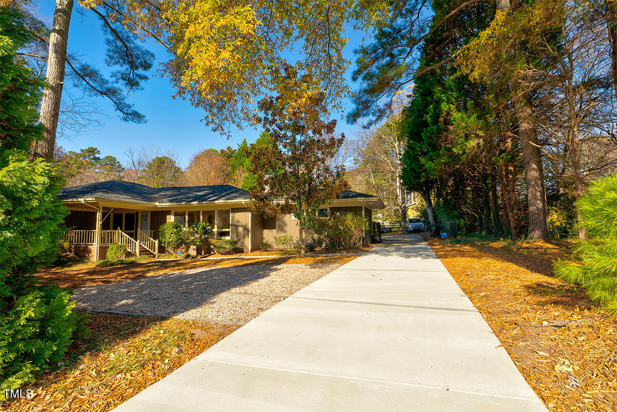 a view of house with yard