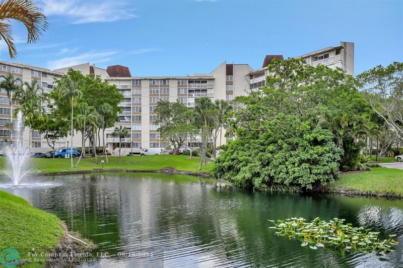 a view of a lake with a building in the background