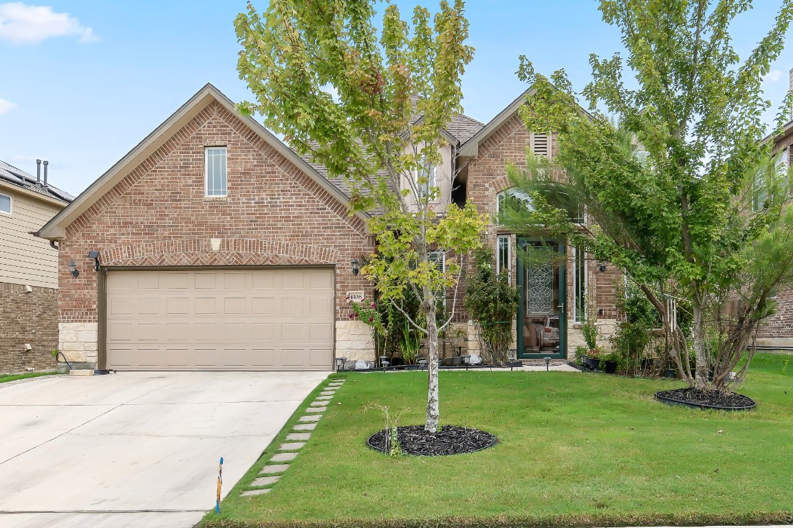 a front view of a house with a yard