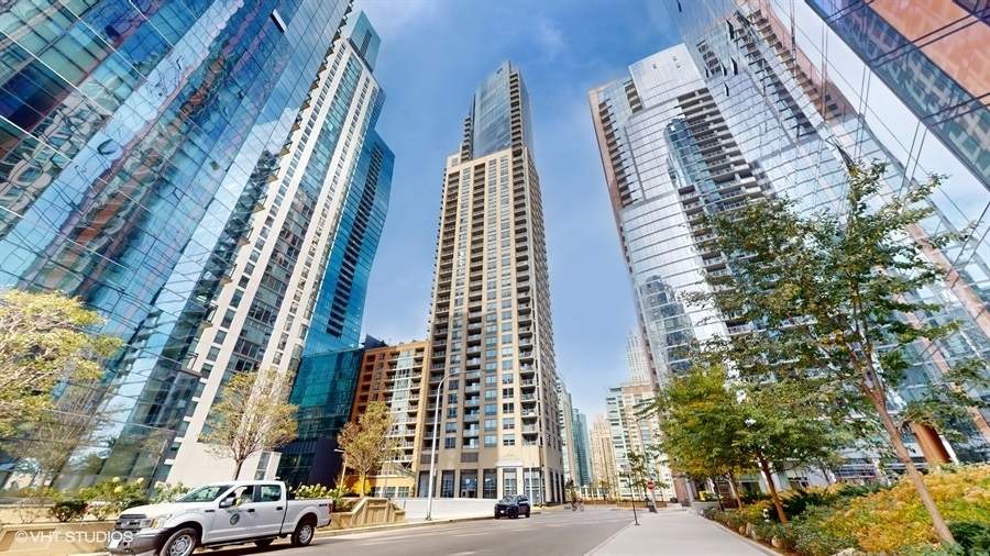 a city view with tall buildings and cars