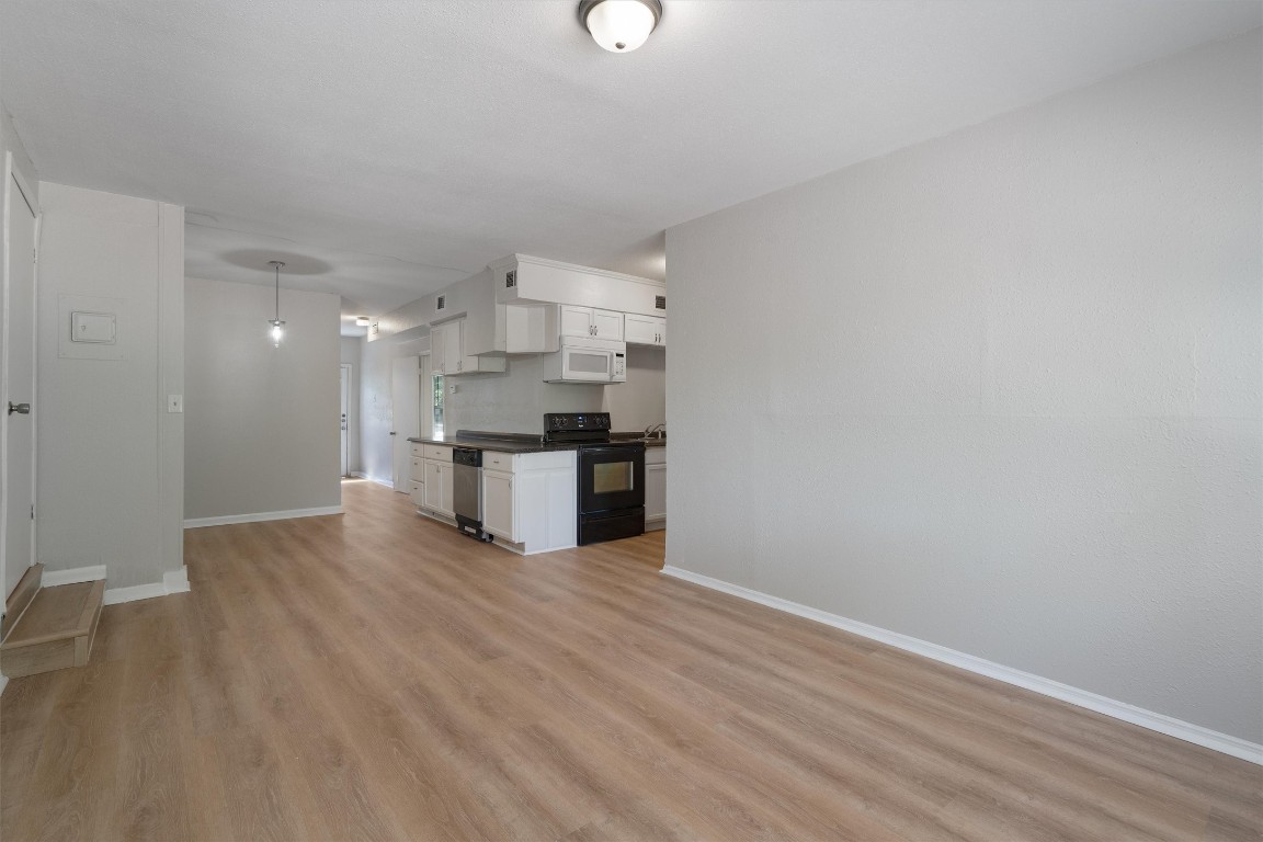 a view of kitchen with wooden floor