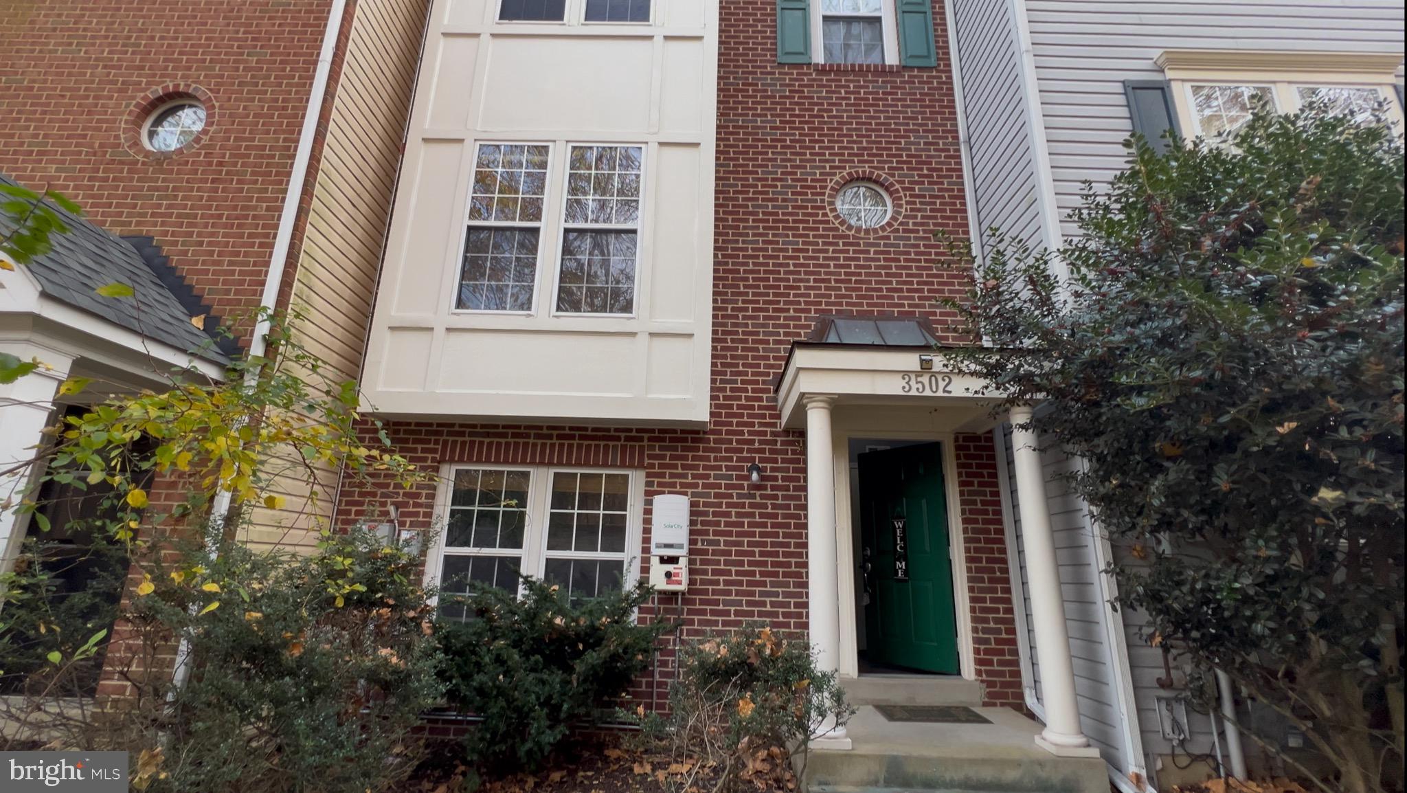 a front view of a house with a large windows