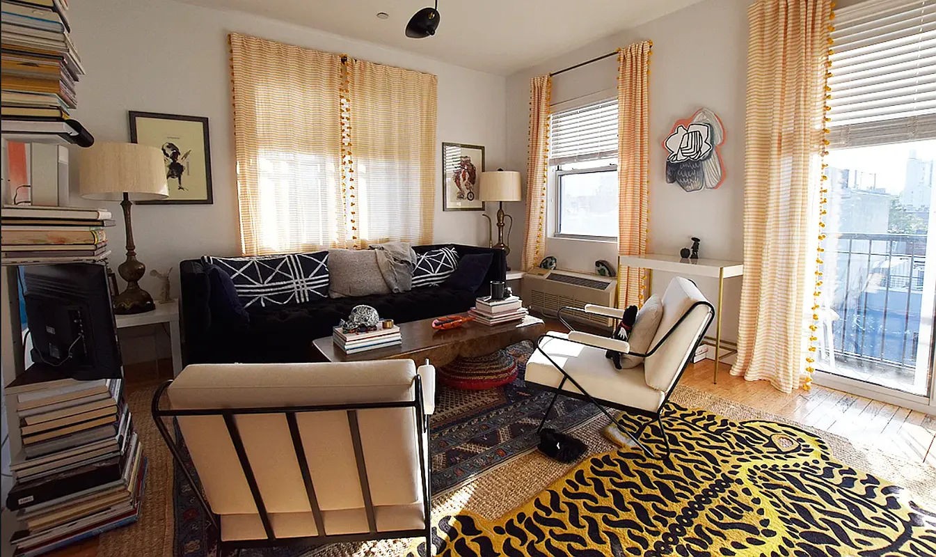 a living room with furniture and a window