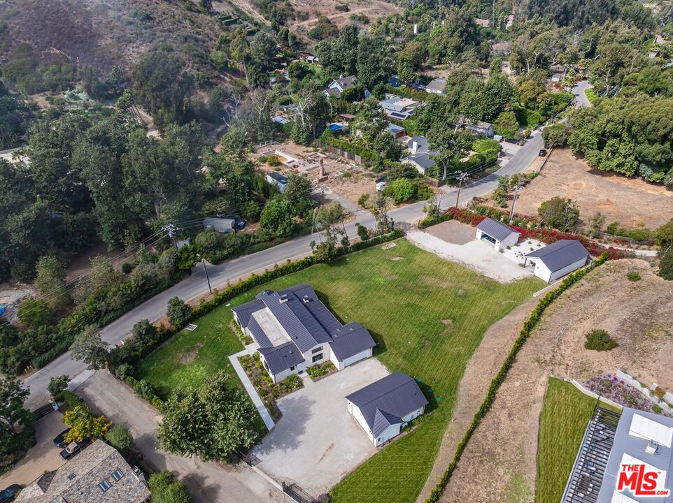 an aerial view of a house with a garden