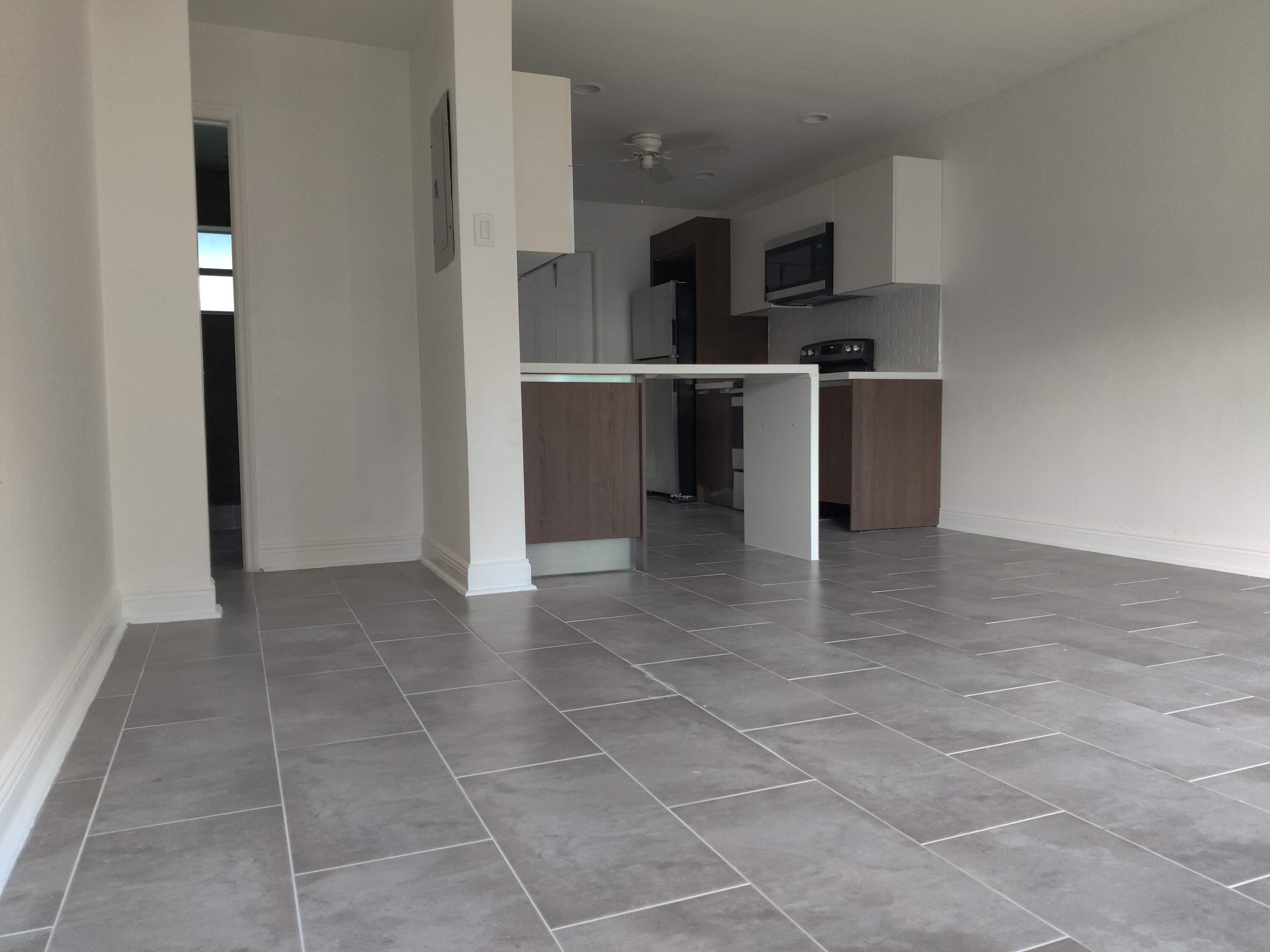 a kitchen with stainless steel appliances a refrigerator and a counter top