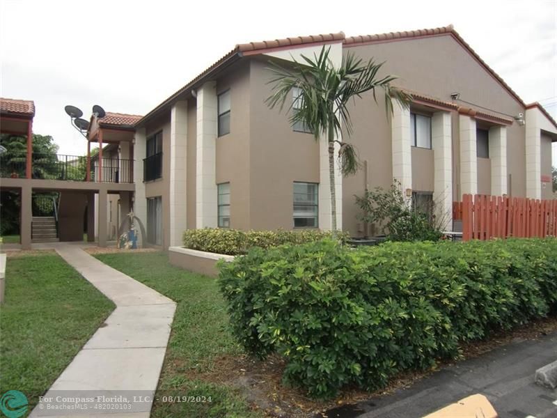 a front view of house and yard with green space