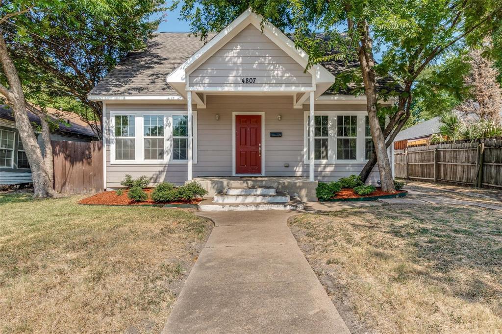 a front view of a house with yard