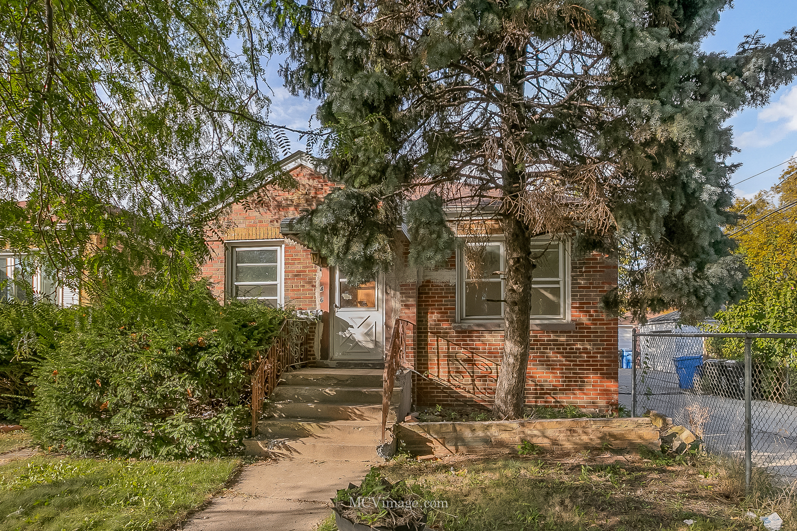 a view of a house with a tree