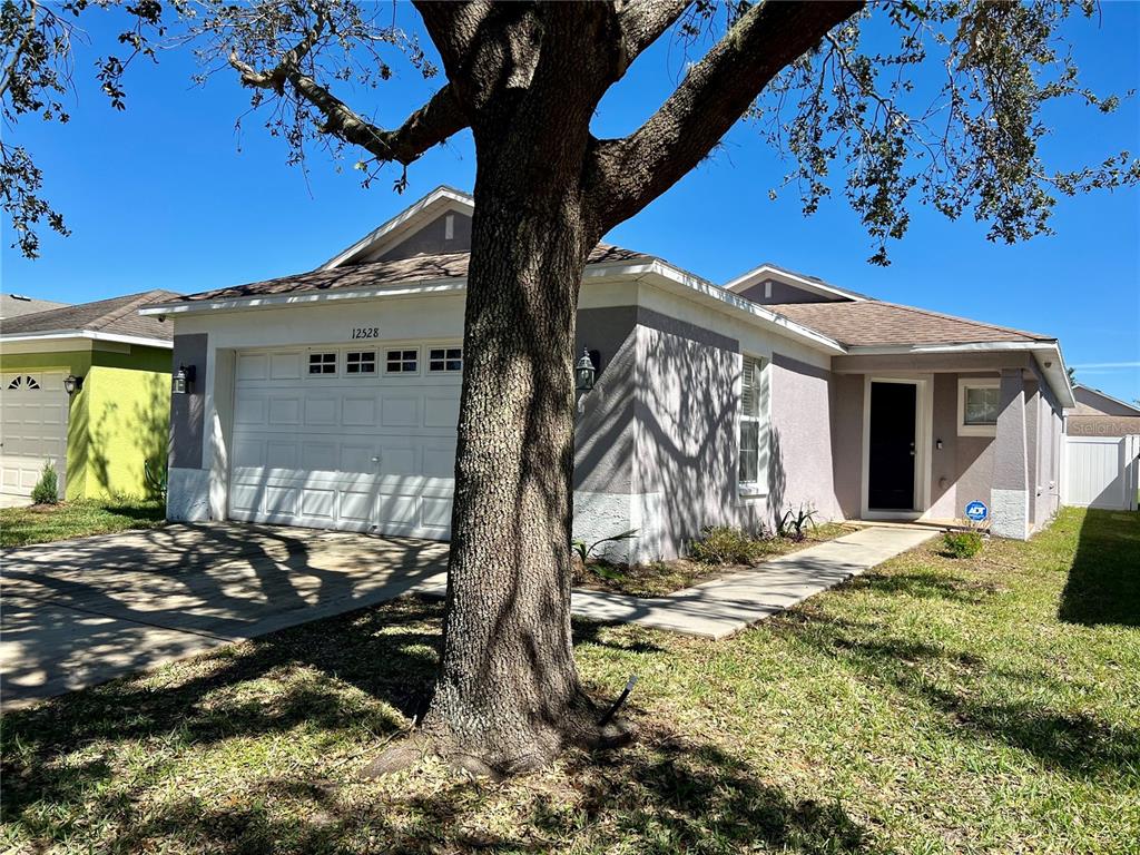 a view of a house with a yard