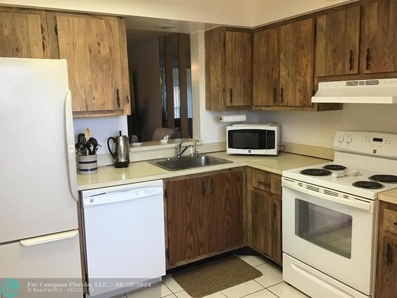 a kitchen with a stove and a sink