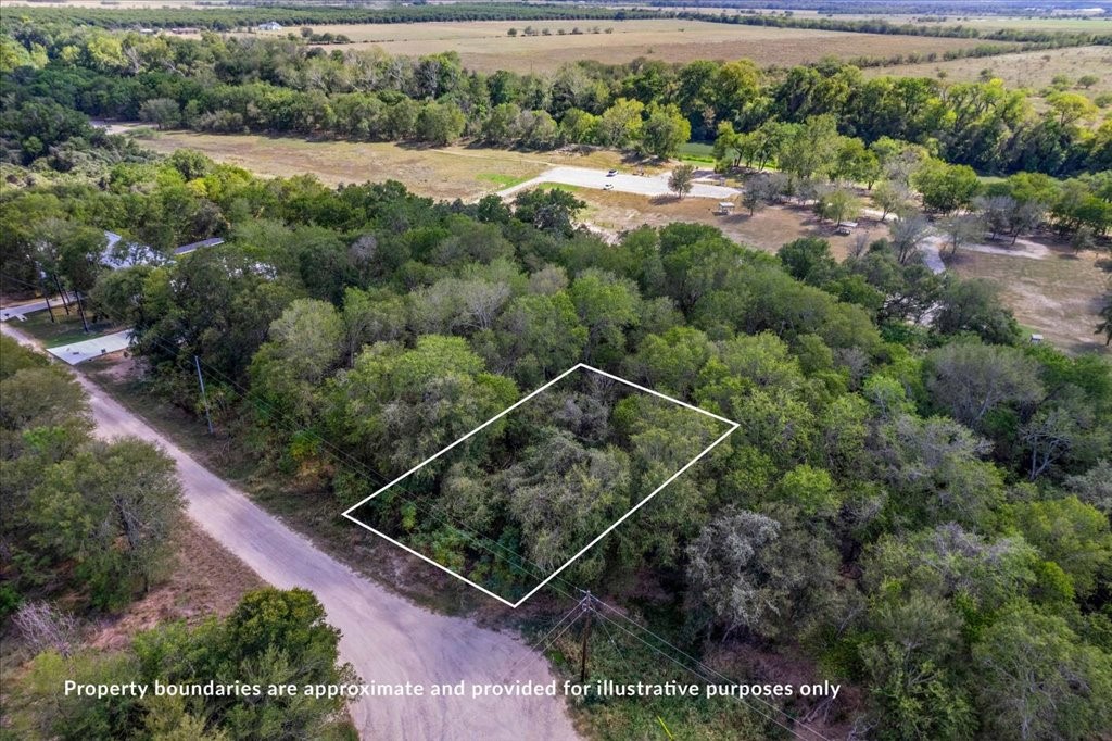 an aerial view of house with yard