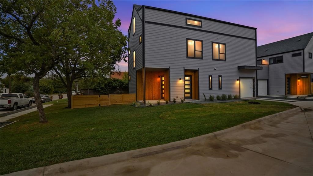 a view of a house with a yard