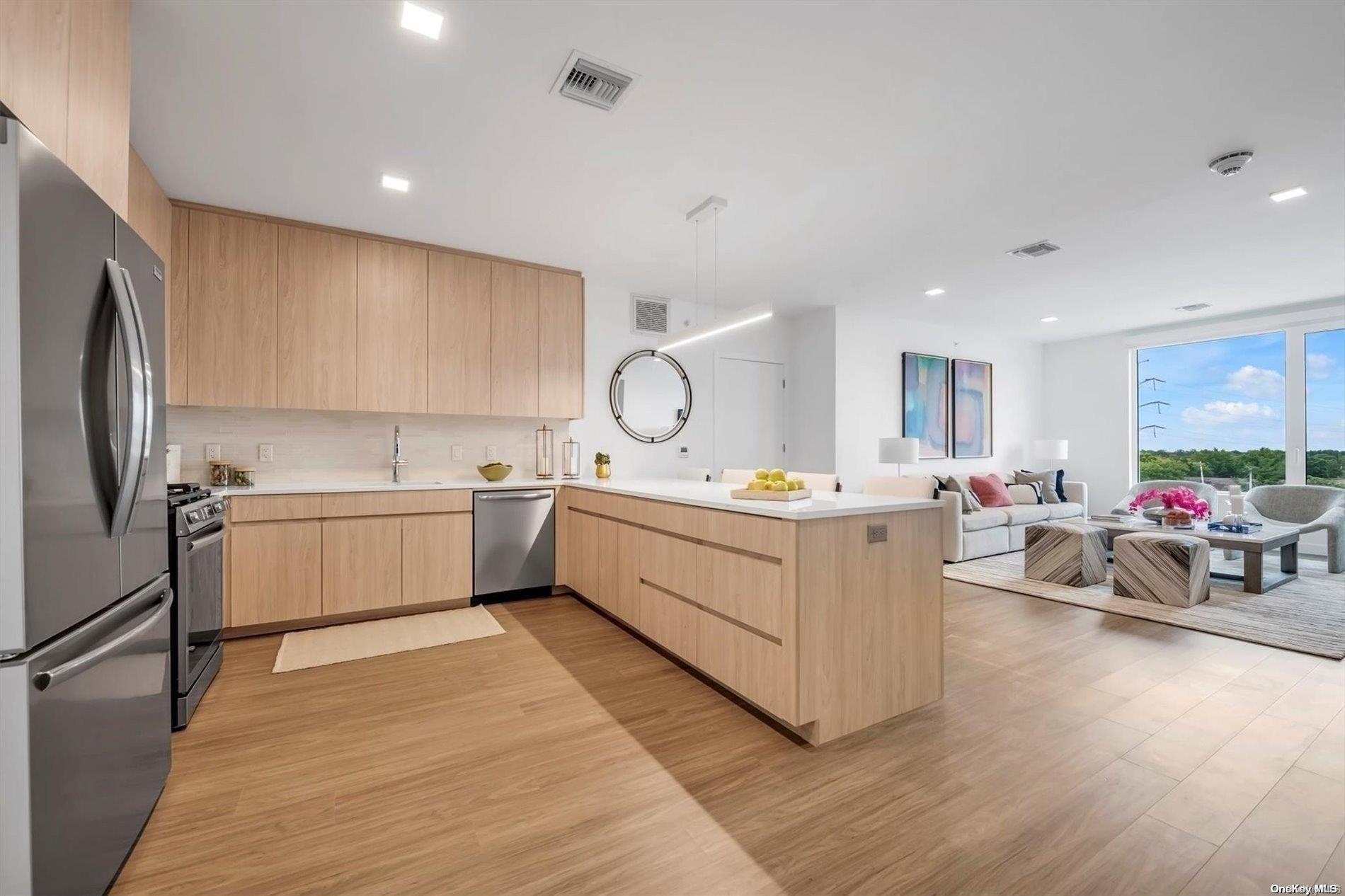 a kitchen with sink a microwave and cabinets