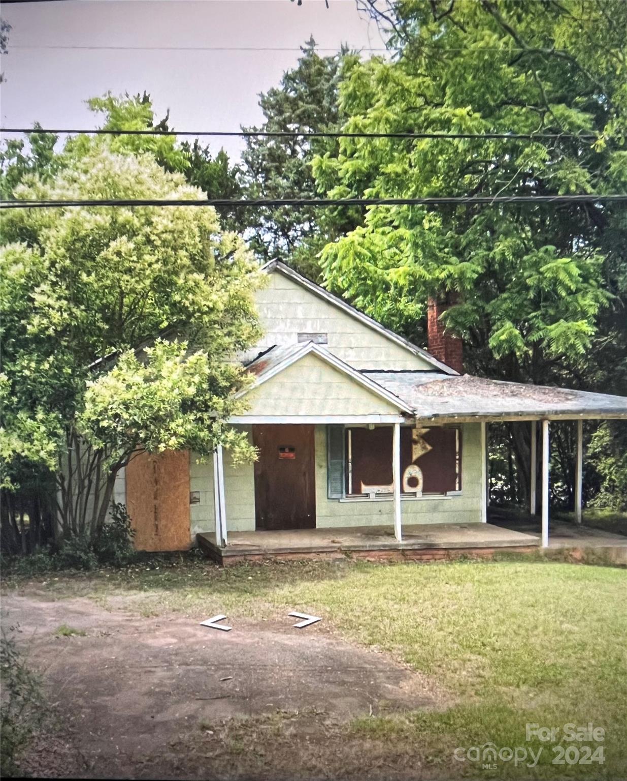 a house with a tree in front of it