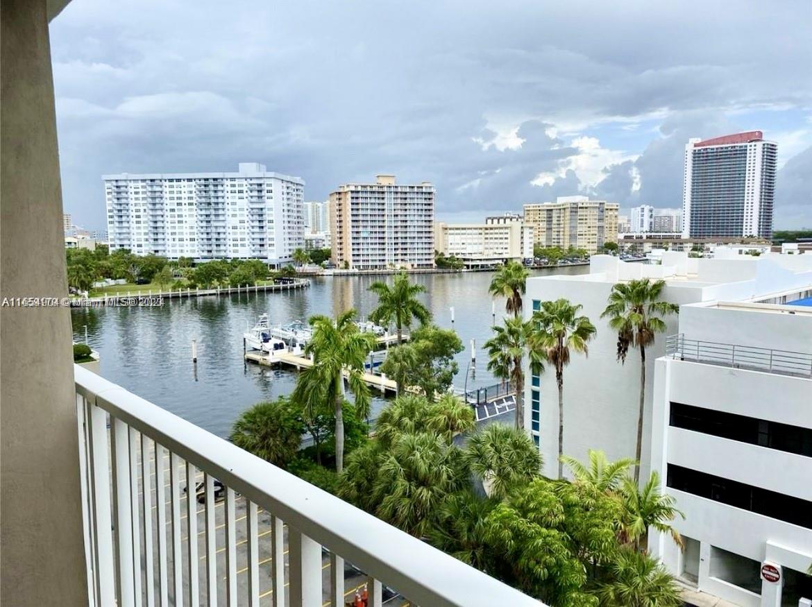 a view of a lake with tall buildings