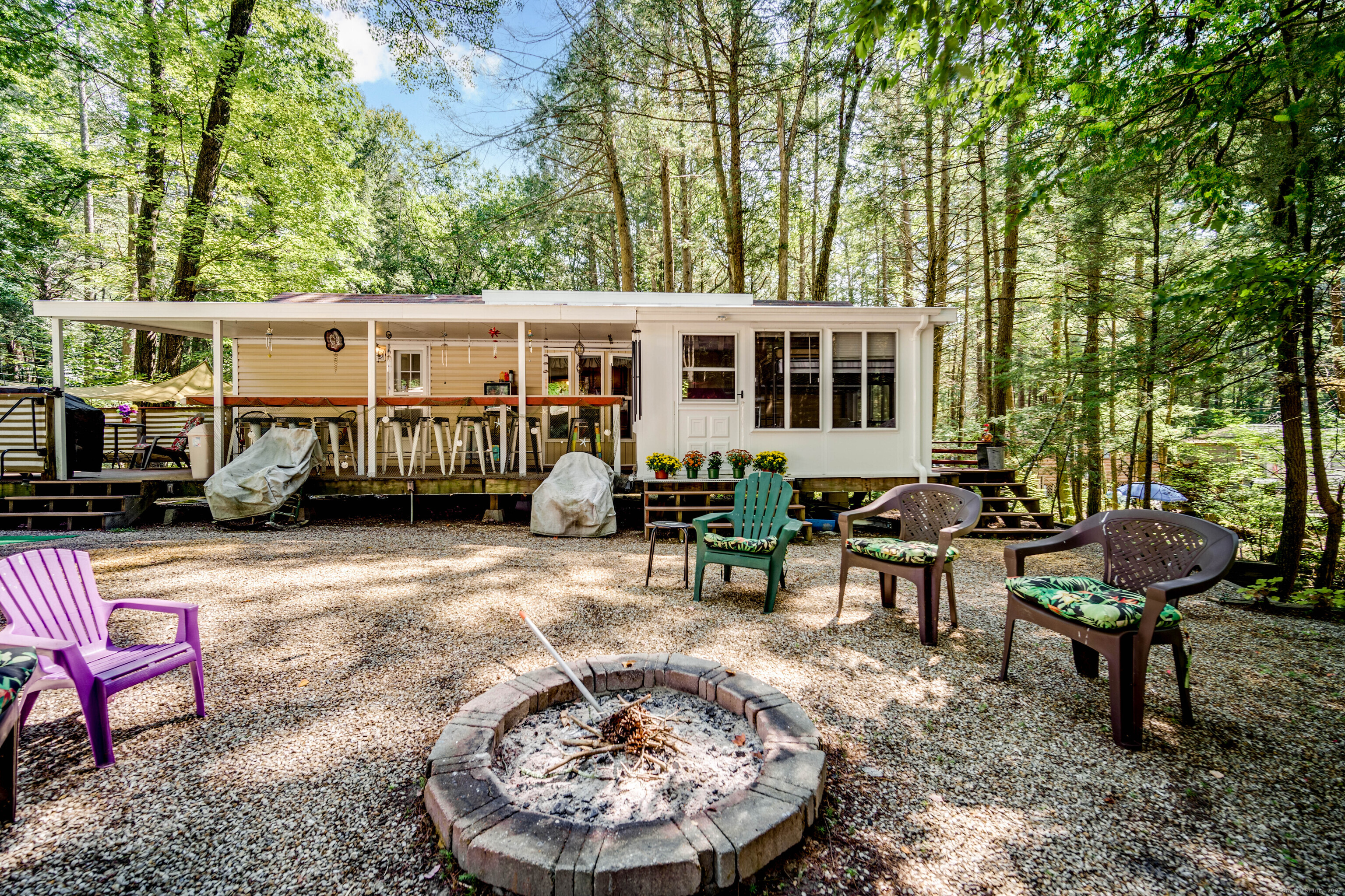 a view of a house with backyard sitting area and sitting area