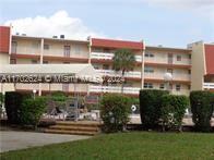 a front view of a building with garden