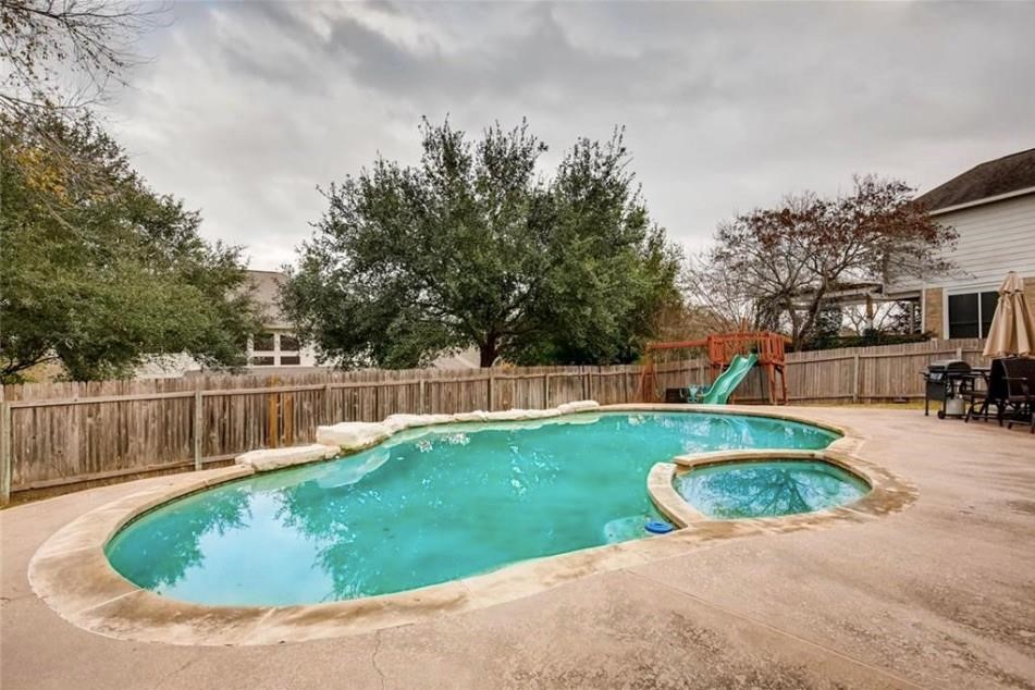 a view of swimming pool having outdoor seating