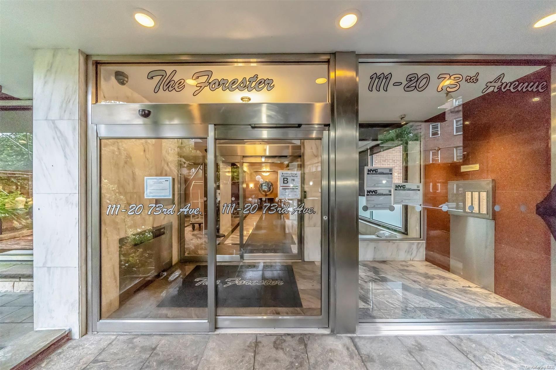 a room with water heater and a glass door shower