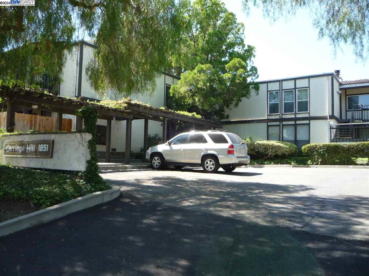 a view of a car park in front of house