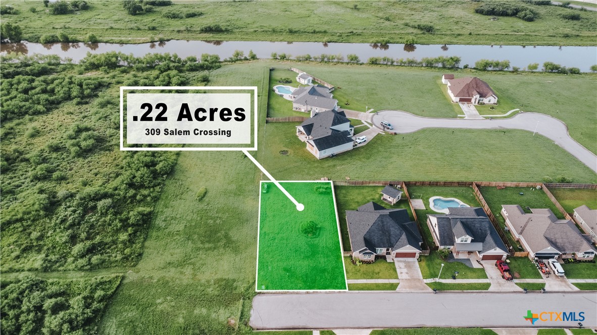 an aerial view of a house with a yard basket ball court and outdoor seating