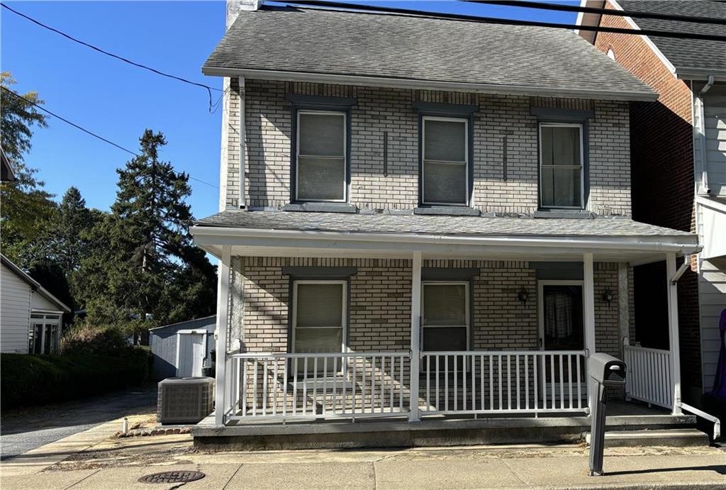 a view of a house with a iron gate