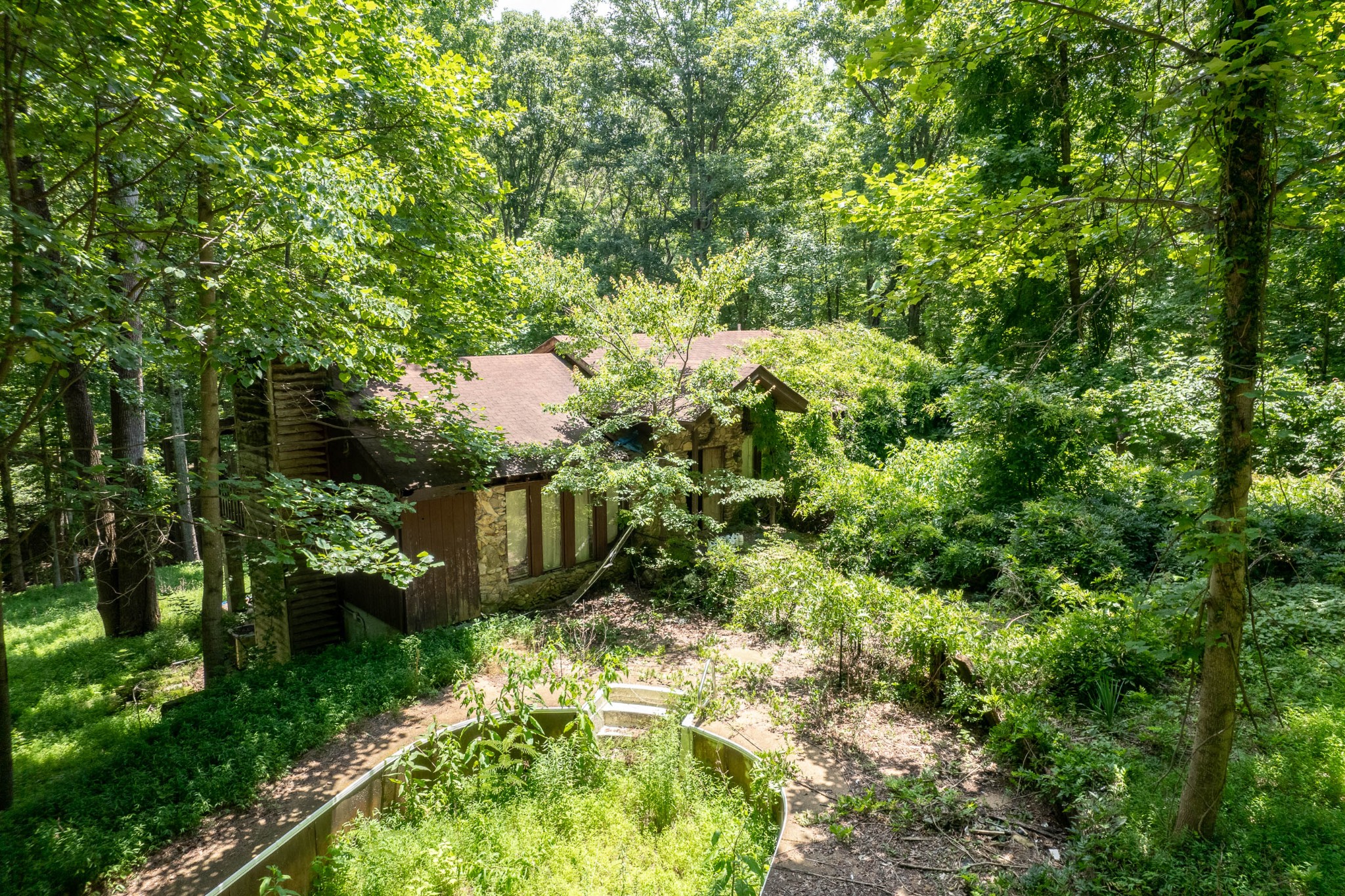 a backyard of a house with a yard and outdoor seating