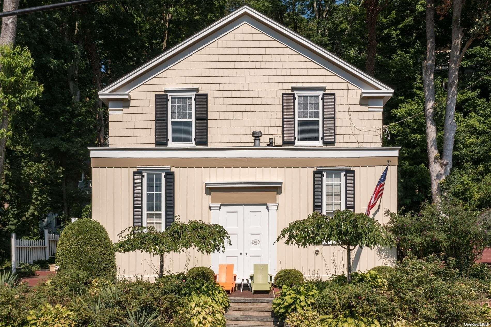 a view of a yard in front view of a house