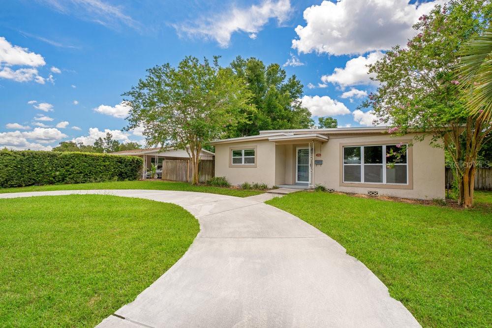 front view of a house with a yard