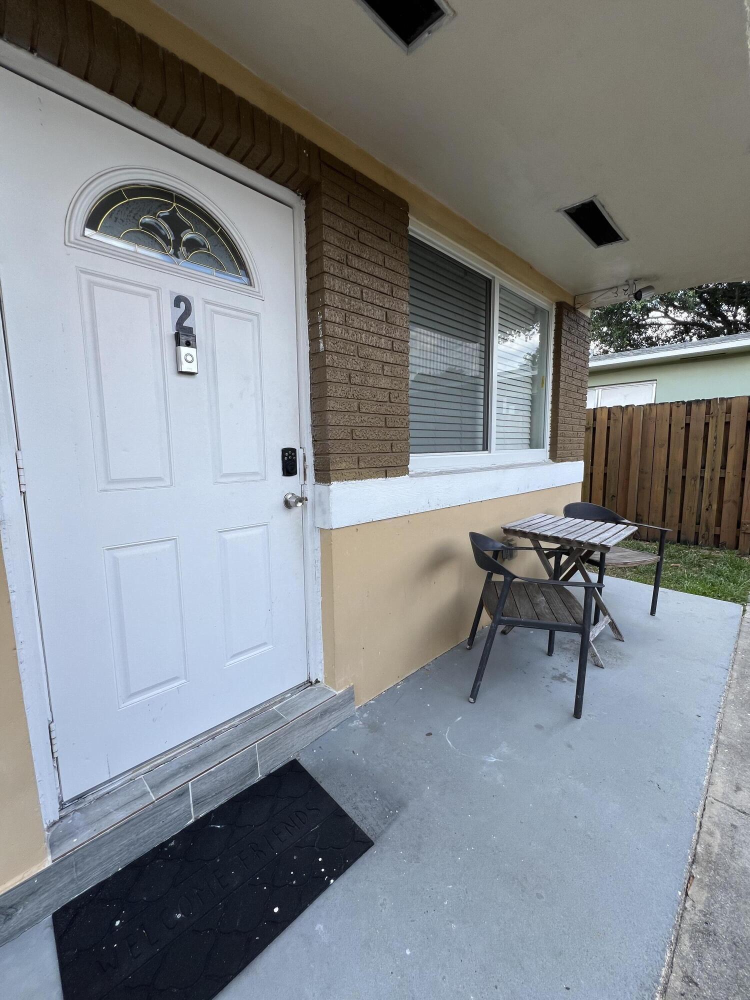 a view of a livingroom with furniture and front door