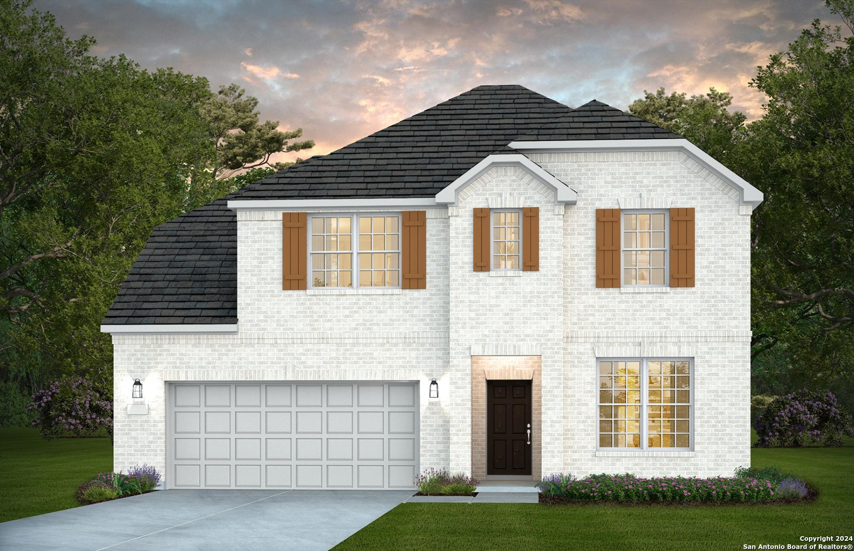 a front view of a house with a yard and garage