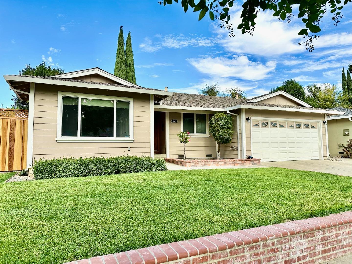 front view of a house with a yard